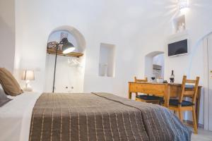 Postel nebo postele na pokoji v ubytování Trulli-eu Guesthouse Alberobello