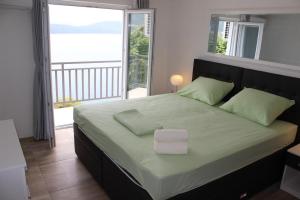 Postel nebo postele na pokoji v ubytování Guest House Put