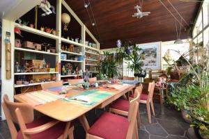 a dining room with a large wooden table and chairs at Ann Arbor Bed and Breakfast in Ann Arbor