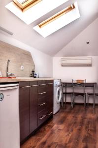 a kitchen with a sink and a dishwasher at Apartment Elegant in Velingrad
