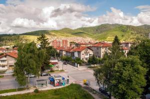 a view of a town with mountains in the background at Apartment Elegant in Velingrad
