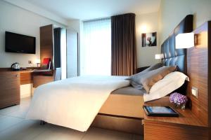Telewizja i/lub zestaw kina domowego w obiekcie Aqua Hotel