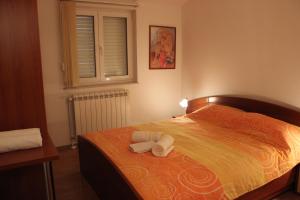 Postel nebo postele na pokoji v ubytování Apartments Lucija + 37 fotografií