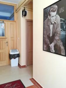 a picture of a man on a wall next to a door at Cinema House Single & Double Rooms & Studio Apartments in Pula
