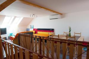 a view of a living room and dining room at APARTMÁN CABERNET in Velké Pavlovice
