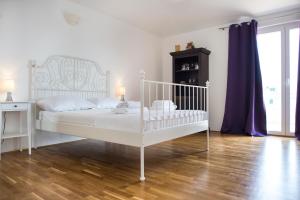 Postel nebo postele na pokoji v ubytování Villa Mira