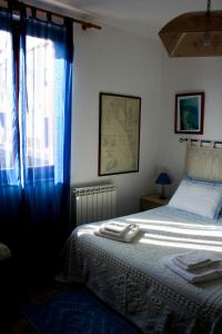Giường trong phòng chung tại B&B Il Porto Vecchio