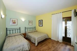 מיטה או מיטות בחדר ב-Casa Borruel