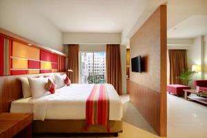Voodi või voodid majutusasutuse Kyriad Hotel Airport Jakarta toas