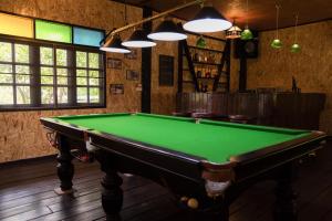 a billiard room with a green pool table at Little Village Chiang Mai in Chiang Mai