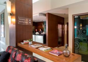 a room with a counter with books on it at Swiss Hotel Apartment in Kuala Belait