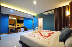 Postel nebo postele na pokoji v ubytování Chiangmai S.P. Hotel + 37 fotografií