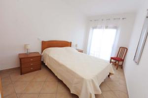 Ένα ή περισσότερα κρεβάτια σε δωμάτιο στο Appartement Quarteira +26 φωτογραφίες