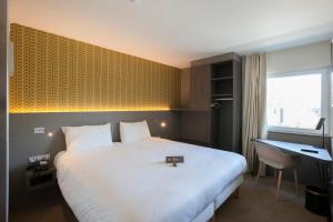 Postel nebo postele na pokoji v ubytování ibis Styles Kortrijk Expo