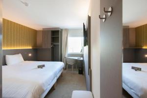 Postel nebo postele na pokoji v ubytování ibis Styles Kortrijk Expo