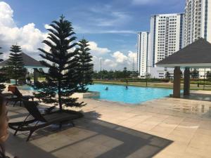 a christmas tree sitting next to a swimming pool at Tagaytay Cool Spot in Tagaytay
