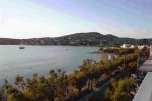 a large body of water with a boat in it at Hotel Paros in Parikia