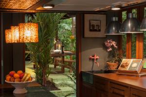 a kitchen with a bowl of fruit on a counter at Chandra Residence in Chiang Mai
