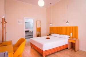 A bed or beds in a room at TheJoy City Suites