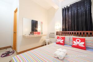 Postel nebo postele na pokoji v ubytování Hotel Georgina