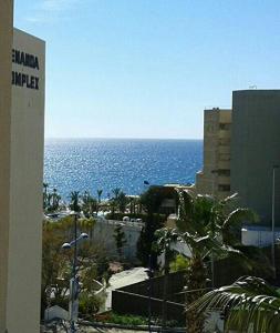 a view of the ocean from a building at Limassol Seaside Apartment in Limassol