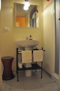 a bathroom with a sink and a mirror at B&B Al Canto del Cavour in Pistoia
