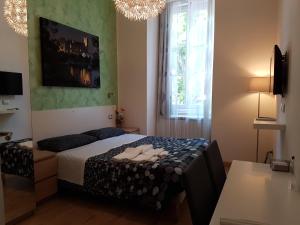 Postel nebo postele na pokoji v ubytování Rooms Boutique Carducci