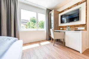 Sjónvarps- og/eða afþreyingartæki á Hotel Tilia