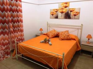 Posteľ alebo postele v izbe v ubytovaní Dammusi Gold - Salvo