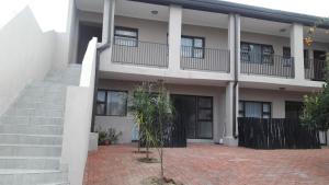 a building with a staircase and a building with windows at Self-catering Studio, Unit 6 on Krupp in Windhoek