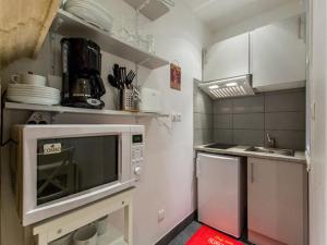 Virtuve vai virtuves zona naktsmītnē Appart Cozy / Quartier St Pierre