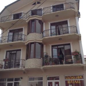 a tall building with windows and balconies on it at Hotel Chaika in K'obulet'i