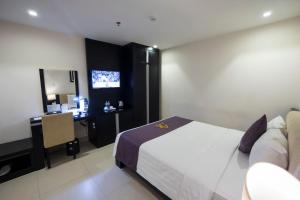 Postel nebo postele na pokoji v ubytování Azumaya Hotel Da Nang
