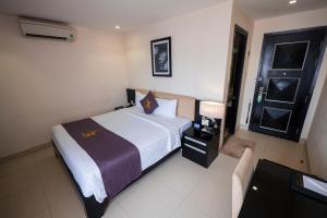 Postel nebo postele na pokoji v ubytování Azumaya Hotel Da Nang