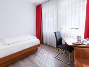Postel nebo postele na pokoji v ubytování DORMERO Hotel Dresden Airport