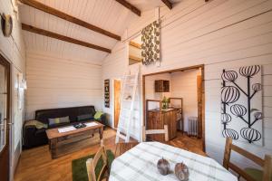 a room with a bed and a couch and a table at Geysir Hestar in Haukadalur