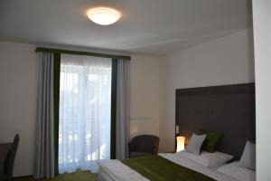 מיטה או מיטות בחדר ב-Nobless Resort