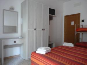 Postel nebo postele na pokoji v ubytování Hotel Luana