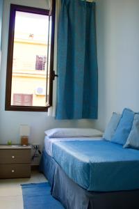 Postel nebo postele na pokoji v ubytování B&B Cinisi Mare e Monti