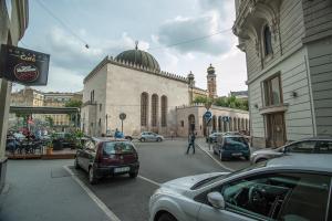 a building with a mosque in the middle of a street at Designer loft at the Great Synagogue in Budapest