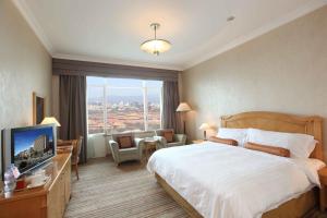 TV a/nebo společenská místnost v ubytování Beijing Hotel