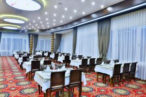 a dining room with tables and chairs in a room at Elazığ Marathon Hotel in Elazığ +23 photos