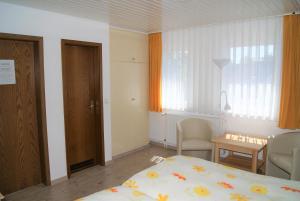 Postel nebo postele na pokoji v ubytování Hotel Braunlage