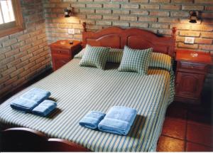 Una cama o camas en una habitación de Cabañas Outdoor