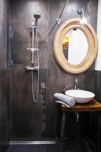 a bathroom with a sink and a mirror at Designer loft at the Great Synagogue in Budapest