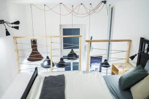 a room with bells hanging above a bed at Designer loft at the Great Synagogue in Budapest