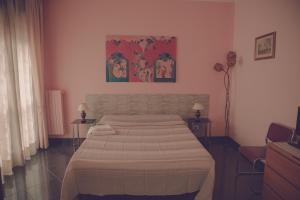 Postel nebo postele na pokoji v ubytování Cassiodoro Rooms Affittacamere