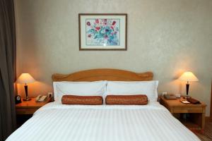 Postel nebo postele na pokoji v ubytování Beijing Hotel