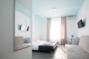 Postel nebo postele na pokoji v ubytování Volna Hotel