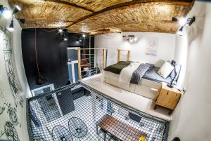 a small room with a bed in the middle at Designer loft at the Great Synagogue in Budapest